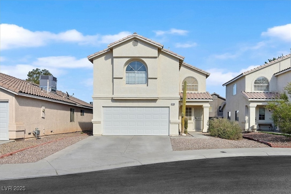 Mediterranean / spanish-style house with stucco siding, driveway, and an attached garage