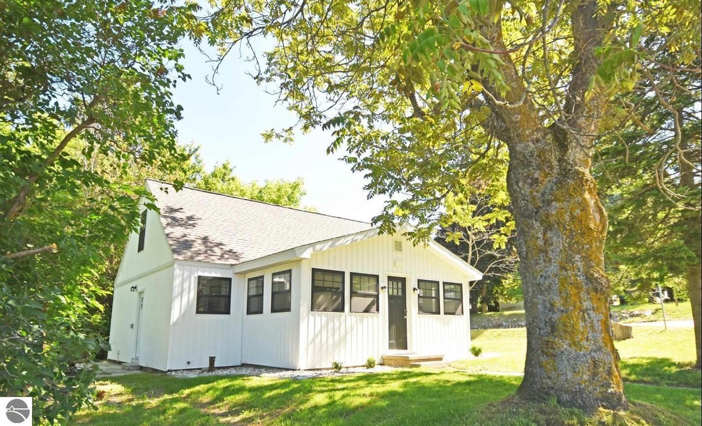 75 E Mill St, Maple City, MI 49664 - photo 1