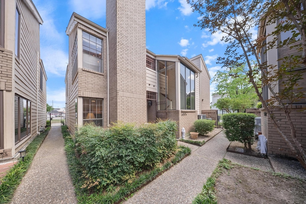 Gated, landscaped walkway leads to a private entra
