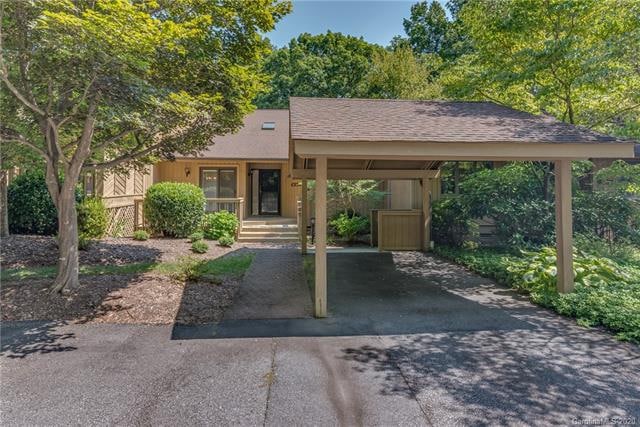 Front of condominium with covered carport