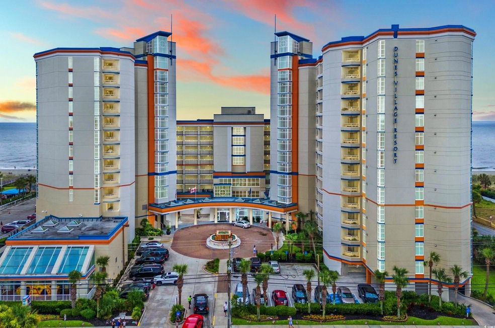 Outdoor building at dusk featuring a water view