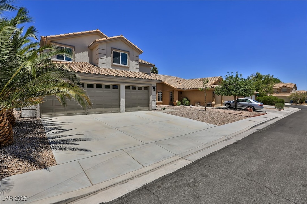 Mediterranean / spanish-style house featuring a ti