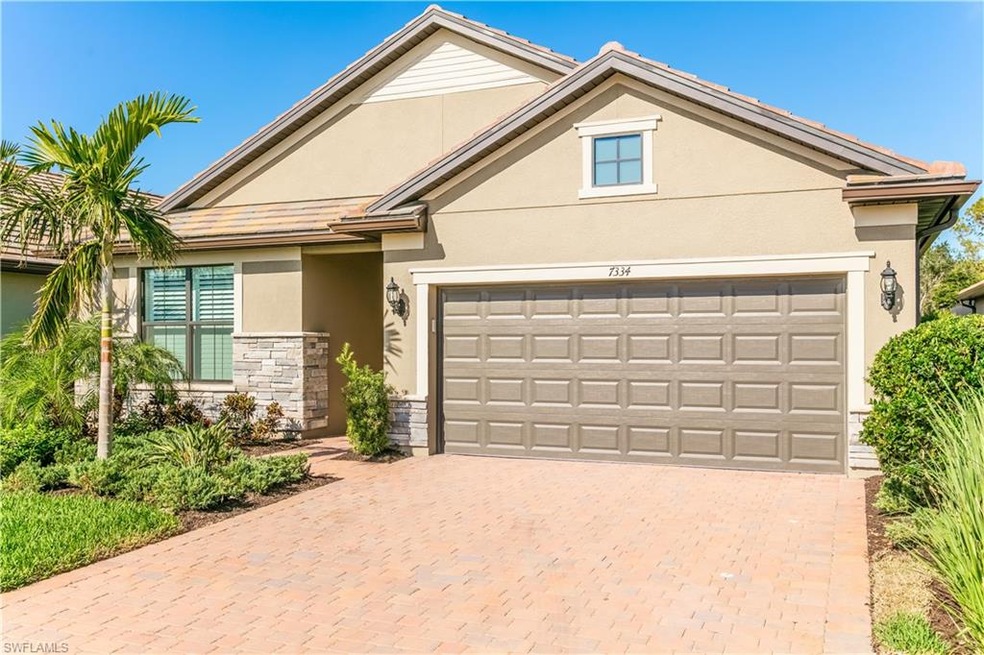 Front elevation at an angle with paver driveway