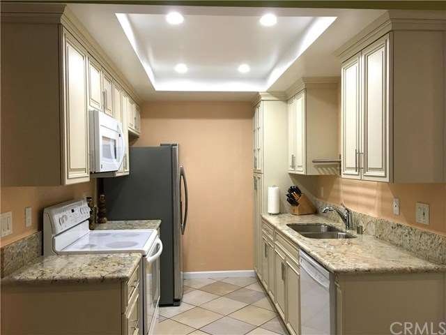 Newly remodeled kitchen with new cabinets and gran