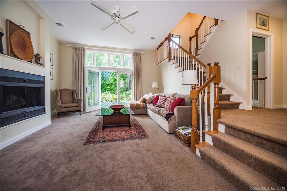 Spacious living room with gas fireplace, high ceil