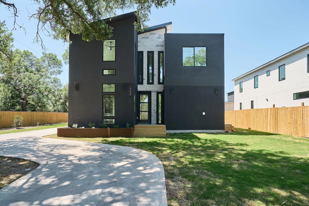 Contemporary home with a front yard, stucco sidin
