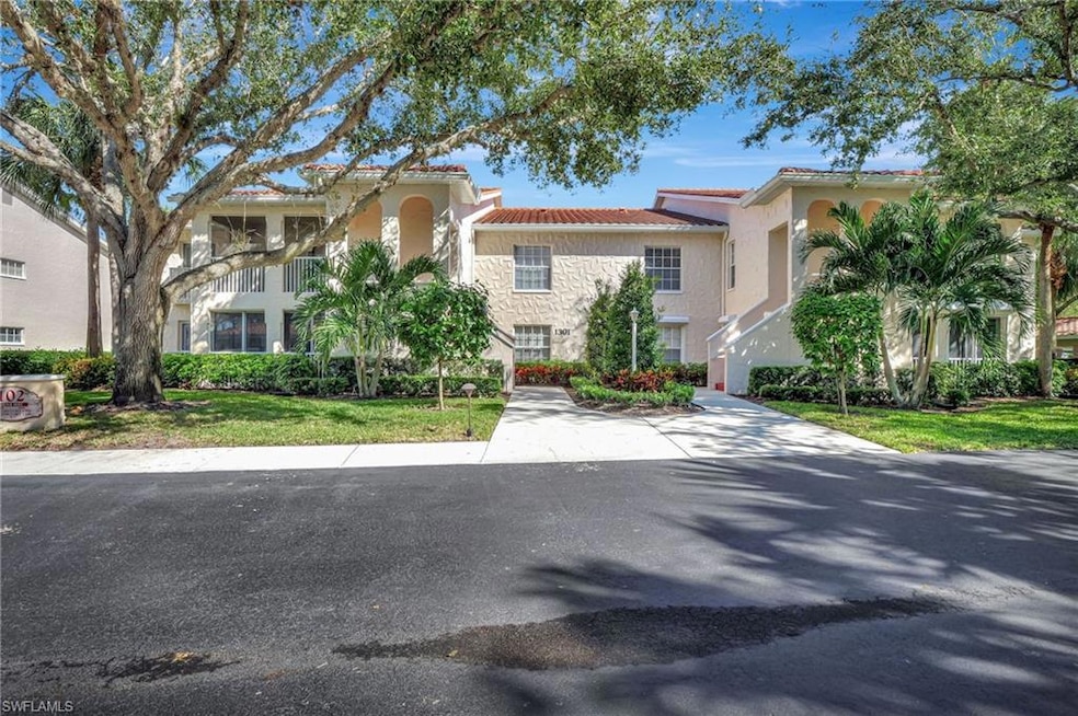 Mediterranean / spanish-style home with a front ya