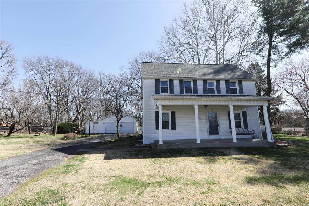 Enjoy your farmhouse front porch right in the middle of town. Nearly 1 acre lot with 3 parcels included.