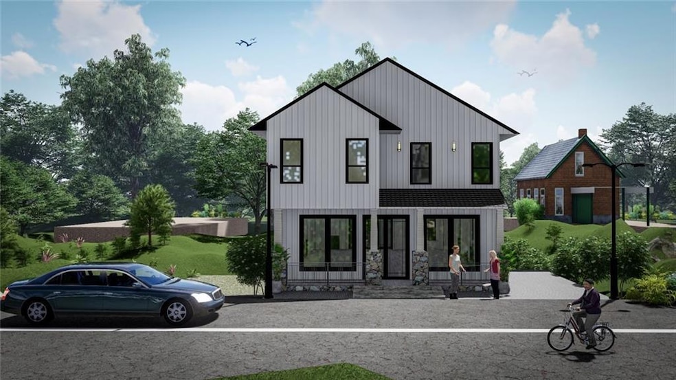 Rear view of house featuring board and batten siding and a yard