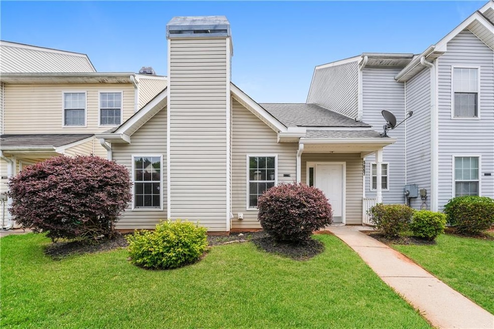 View of front of property with a front lawn and a chimney
