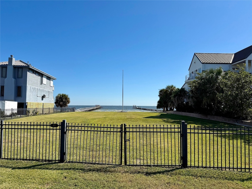 Located in the Bay Vista boutique fenced community, this rare bayfront setting offers sweeping open water views with a generous green space to the 100' bulkheaded shoreline. An ideal opportunity to build a single family home, retreat, or entertainment-focused getaway, with convenient access to Kemah Boardwalk, Galveston, dining, and coastal activities.