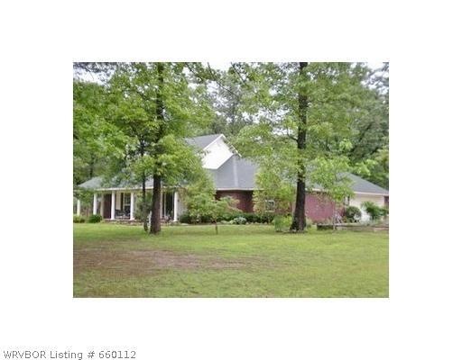 Exterior Front. 2000 HSF BRICK HOME SITTING ON 5 TREED ACRES WITH DETACHED 24X36FT SHOP W/BATHROOM.