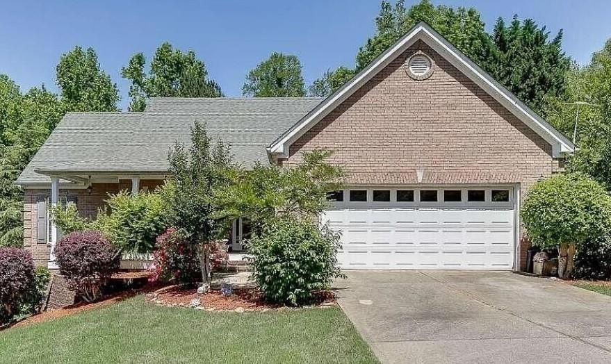 View of front of home featuring a garage