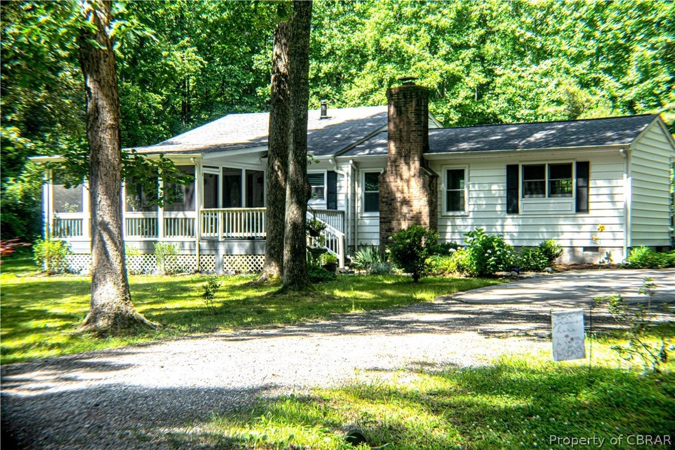 Single story home featuring a front lawn