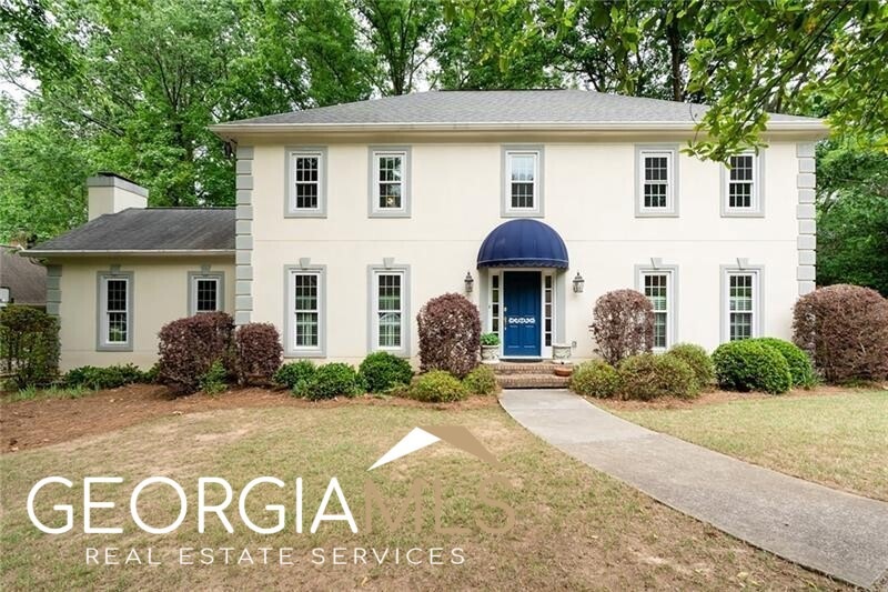 Charming curb appeal with circular driveway in fro