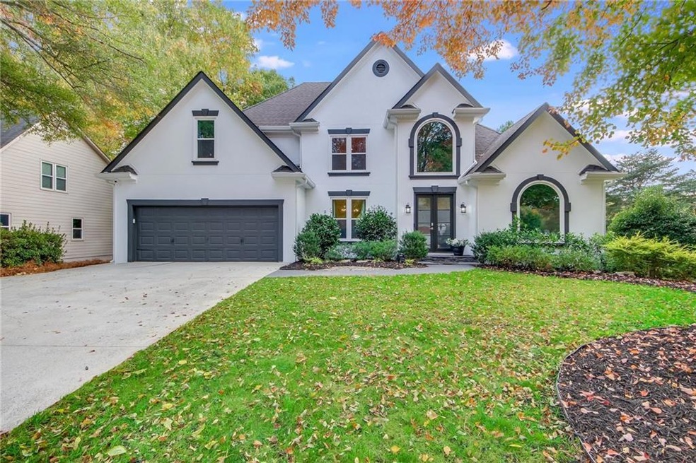 View of front of house featuring a garage and a fr