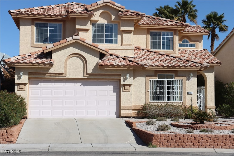 Mediterranean / spanish-style house with driveway,