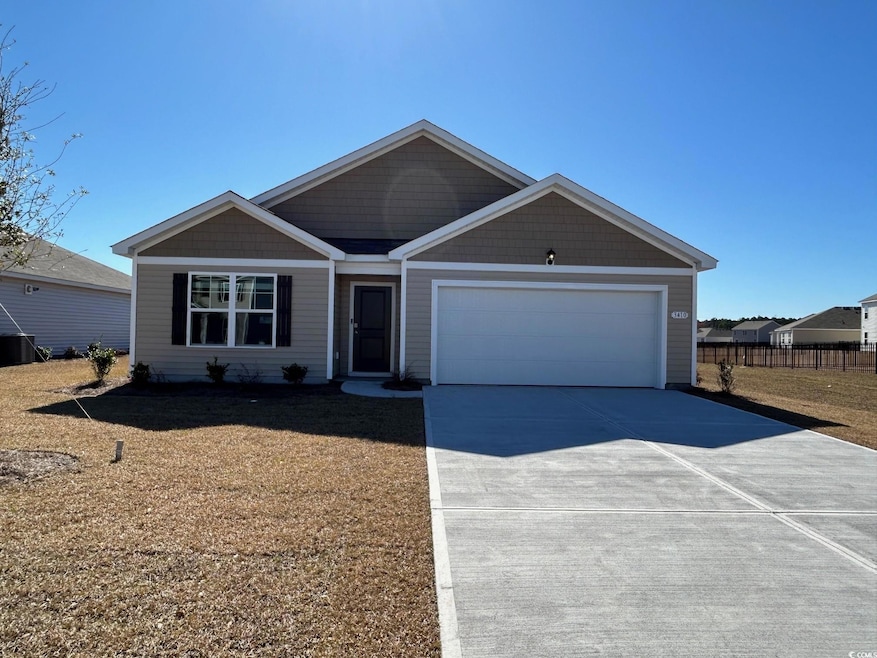 View of front of property with a garage, concrete 