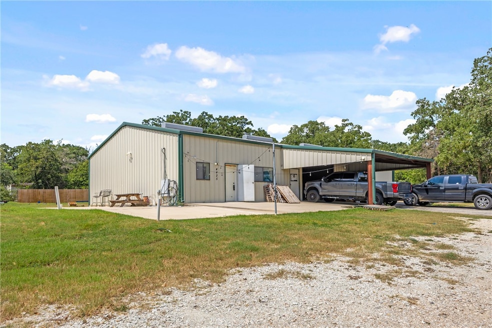 View of outdoor structure featuring a carport