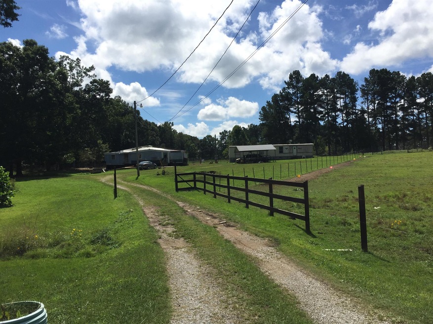Front view of property totaling 7.37 acres. 