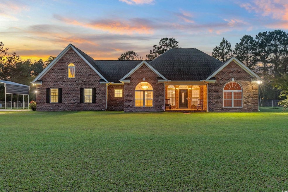 View of front of property featuring a yard