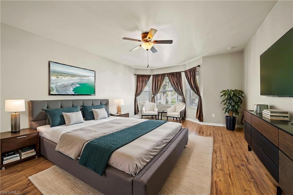 Bedroom featuring ceiling fan and light hardwood /
