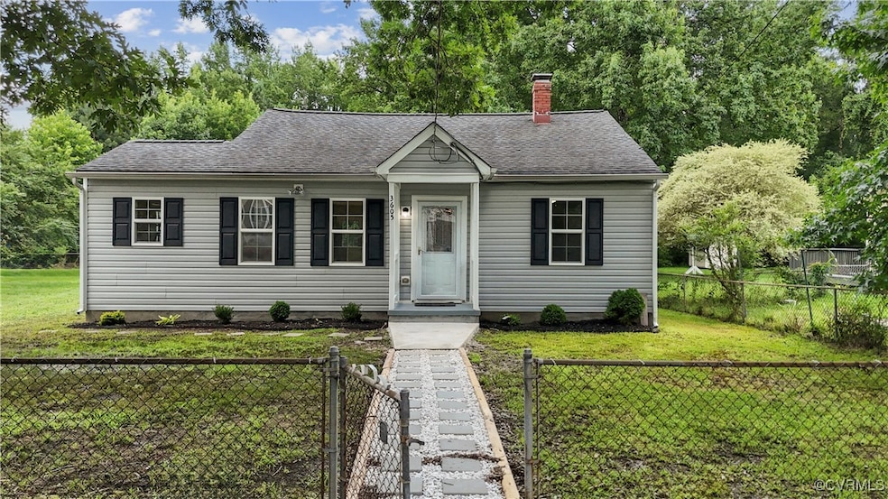 View of front of property with a chimney, a shingl