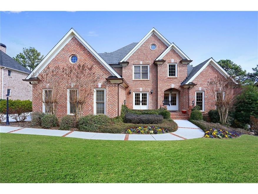 Custom 4-sided brick home with golf course view.