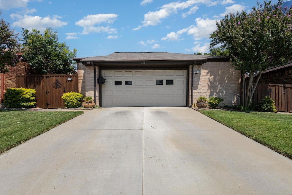 Garage featuring a yard