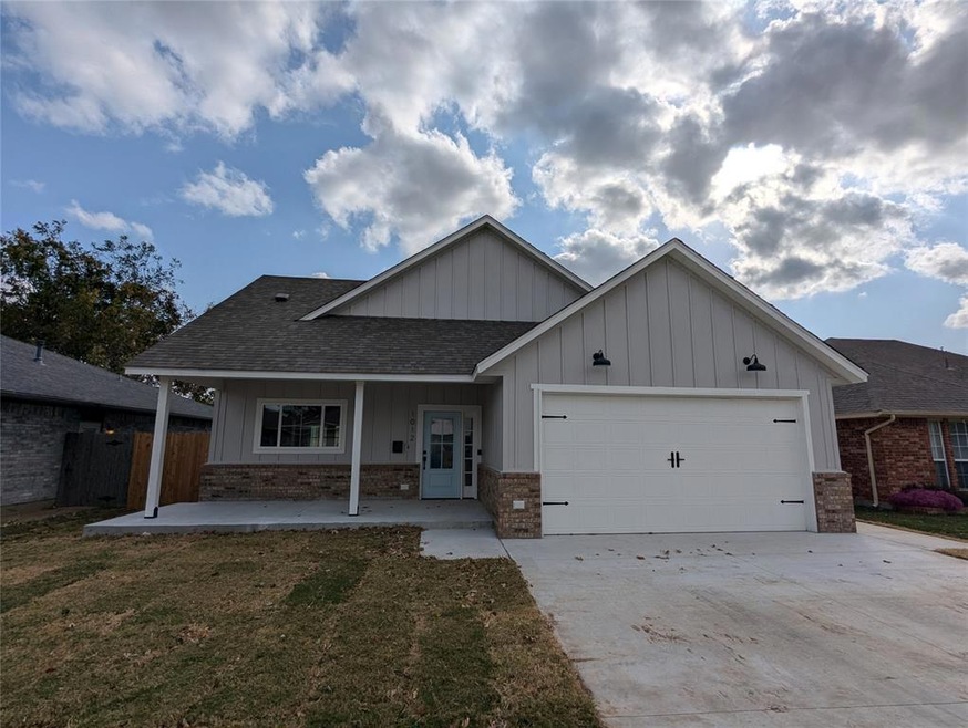View of front of property with a garage and a fron