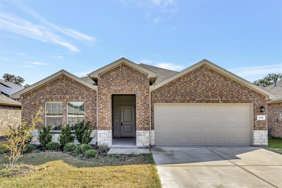 View of front of home with lovely stone accents.