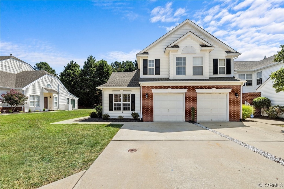 View of front property with garage and a front law