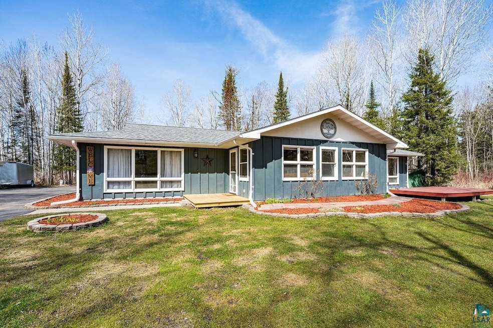 Ranch-style house featuring board and batten sidin