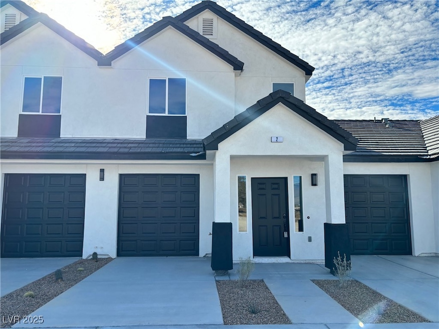 Front of Unit 2 featuring a modern two-tone exteri