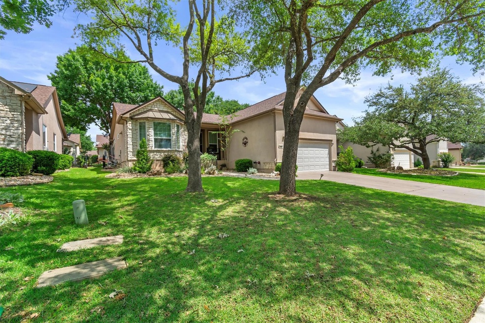 View of front of house featuring stucco siding, a