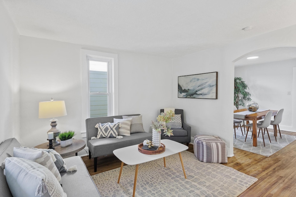 Main level: living room with refinished hardwood floors and all new paint