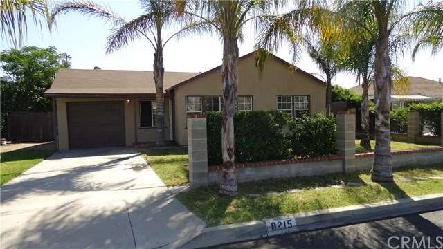 Landscaped front yard with established trees