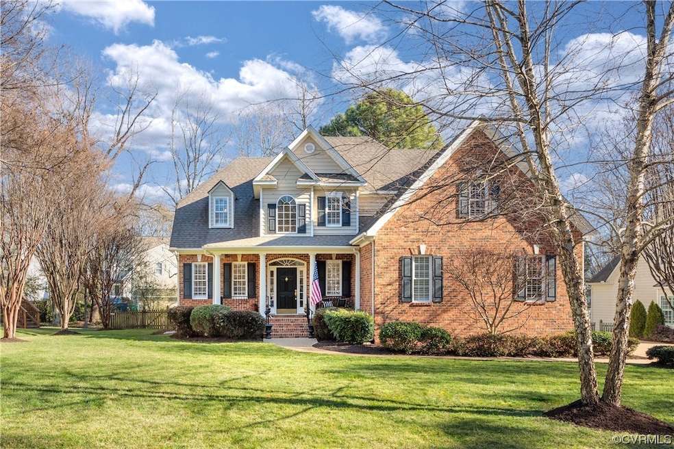 View of front of property with a front yard and a