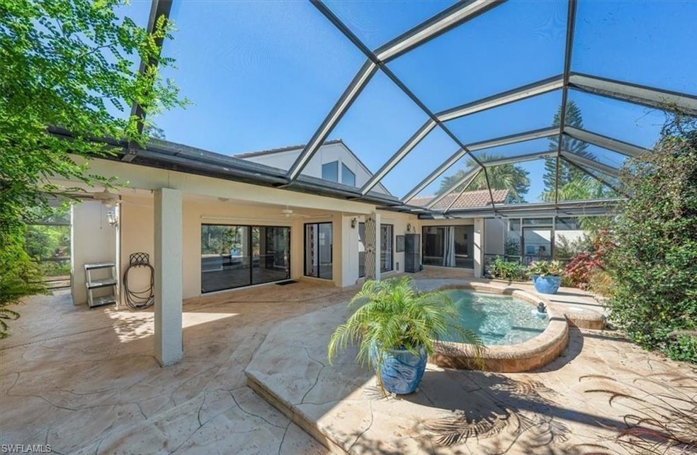 Back of property with ceiling fan, a patio, and gl