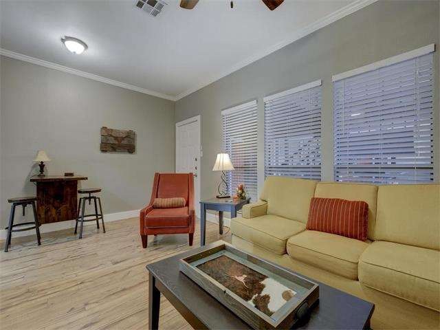 Spacious living room with crown molding.
