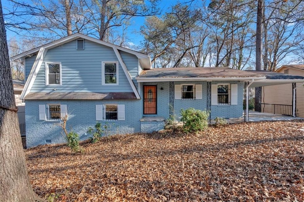 Split level home featuring a carport and covered p