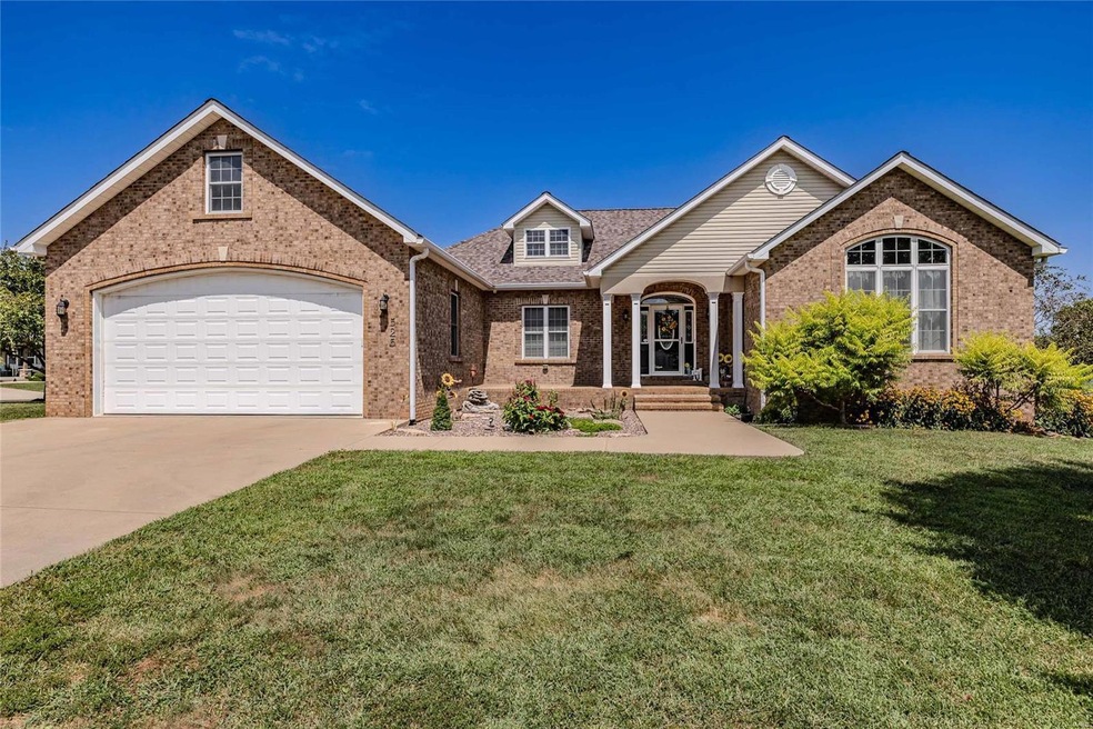 Corner lot with additional detached garage.