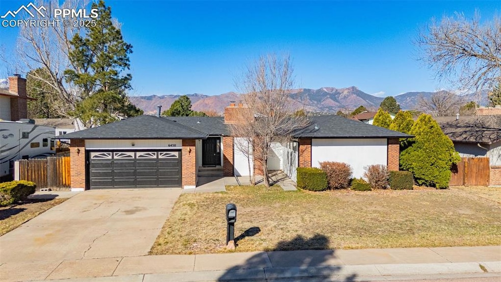 Ranch-style home featuring brick siding, an attach