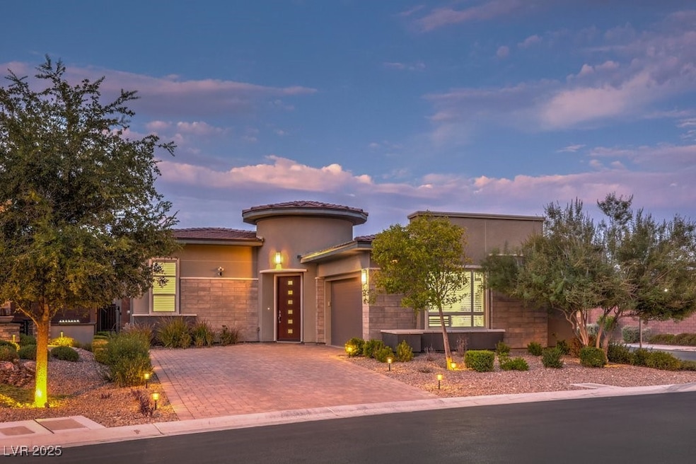 View of front of home featuring stucco siding, a t