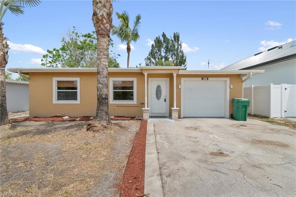 Ranch-style home featuring concrete driveway, an a