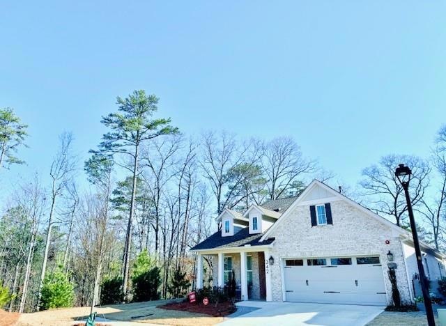 Front of home, wooded lot.