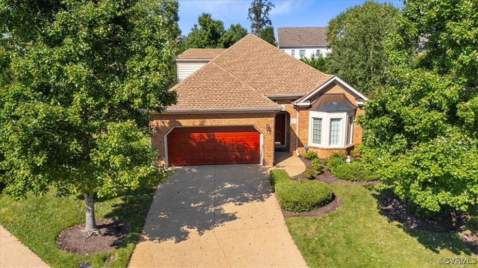 Two car garage, aggregate driveway and beautiful m