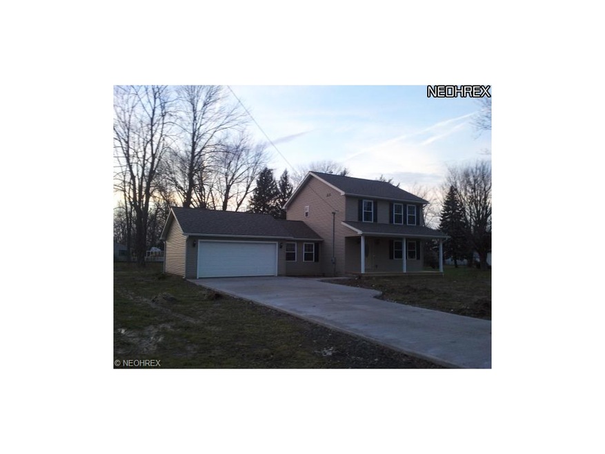 Exterior of home.  New Concrete driveway and sidew