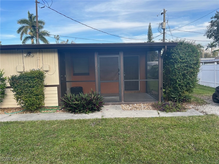 Back of property featuring a sunroom