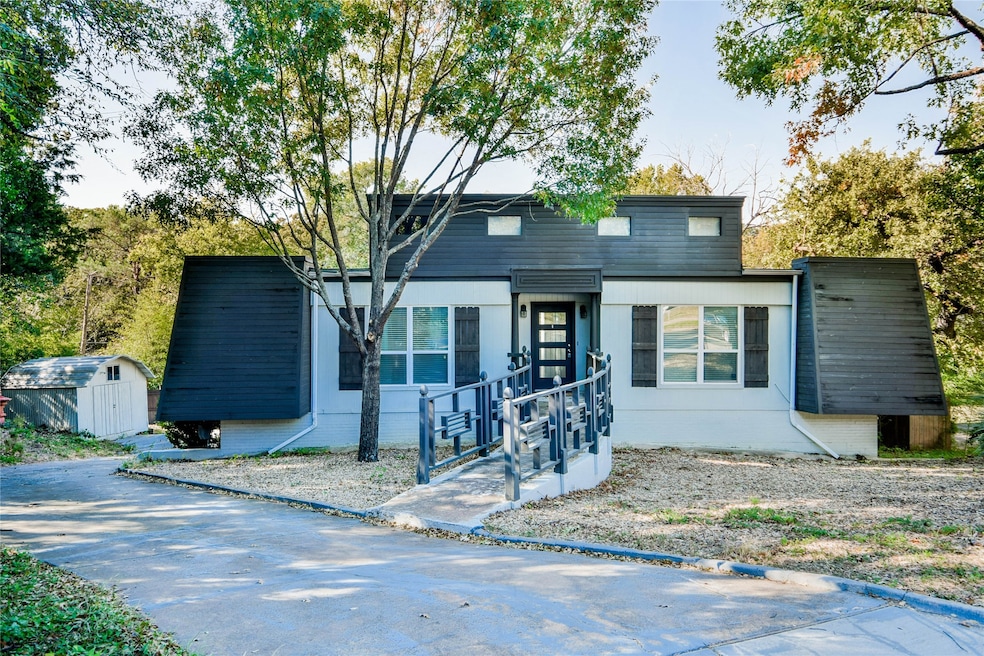Modern home featuring a storage shed